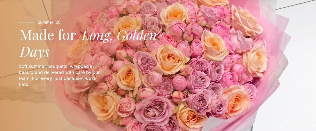 Bouquet of pink and orange roses with text overlay on a light background