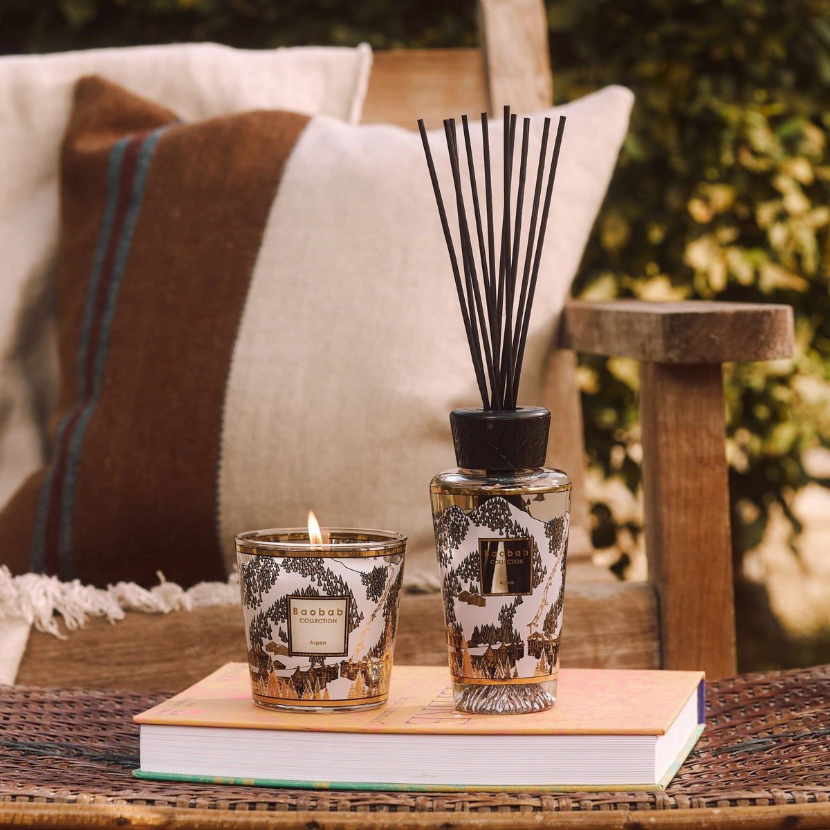 Gift Box My First Baobab Aspen: lit Aspen candle and black-reed diffuser on a book, candle 8 cm, diffuser 250 ml