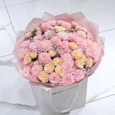 Baby Pink Blush bouquet, size Large: lush bouquet of baby pink chrysanthemums, peach garden roses and blush gypsophila in pink paper, by Daily Flowers