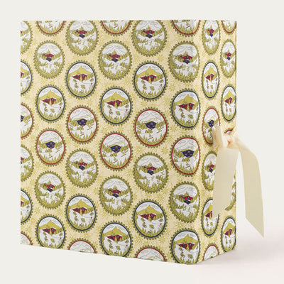 Baobab Advent Calendar Voyage Extraordinaire: closed gold book-shaped calendar with winter sports décor