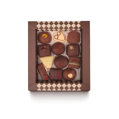 De Bonte Koe Letterbox Bonbons Winter Edition: open brown gift box with 12 handmade winter bonbons