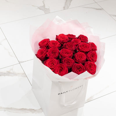 Red roses bouquet side view Daily Flowers